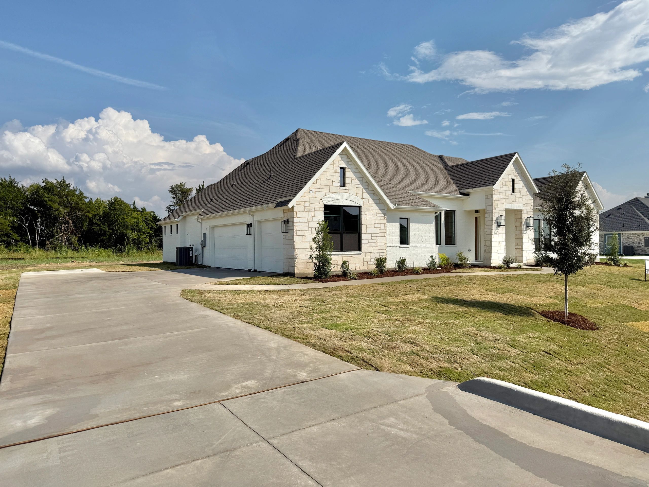 Clean concrete driveway on a Texas home